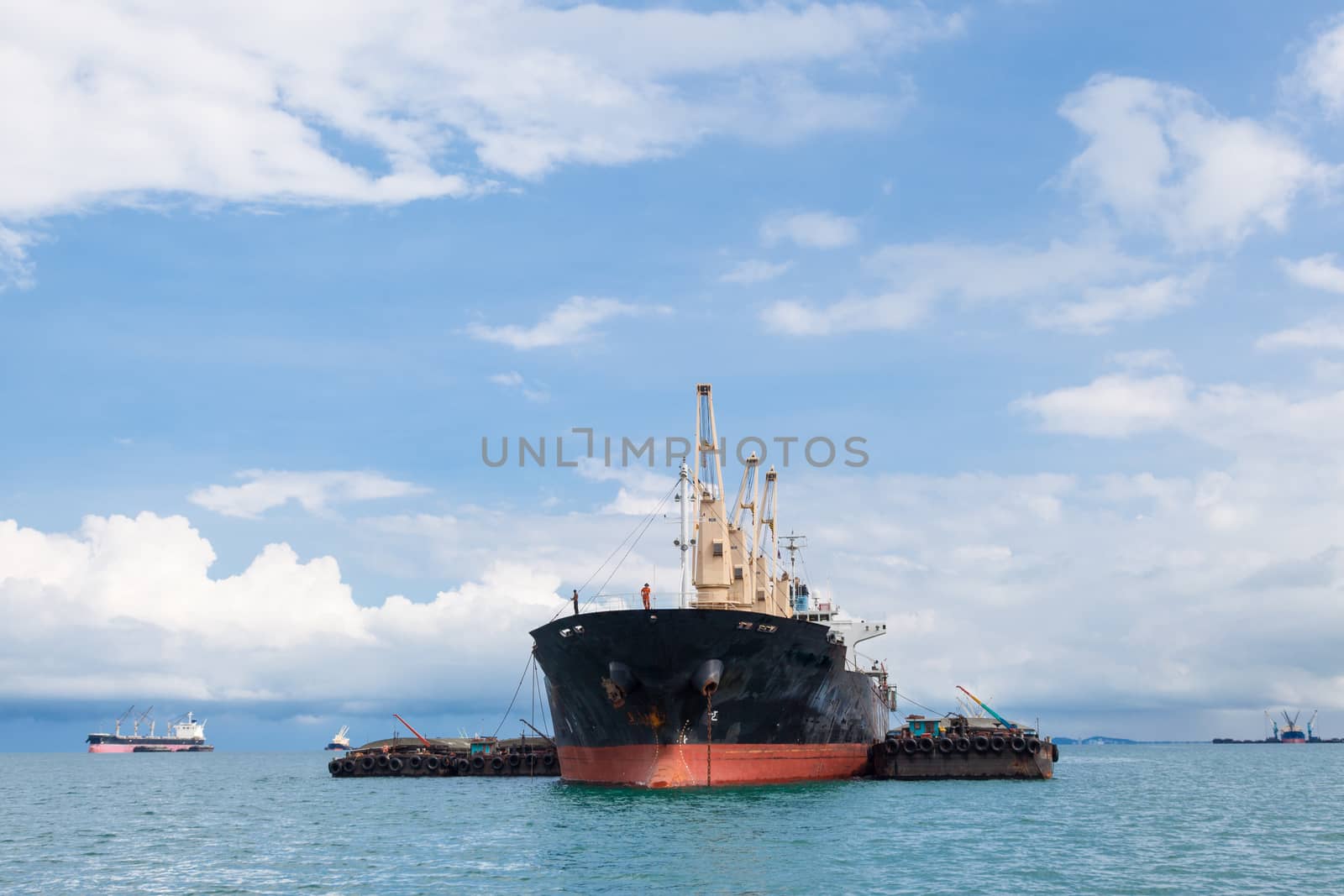 Cargo ship. Parking in the sea to await transportation to the port.