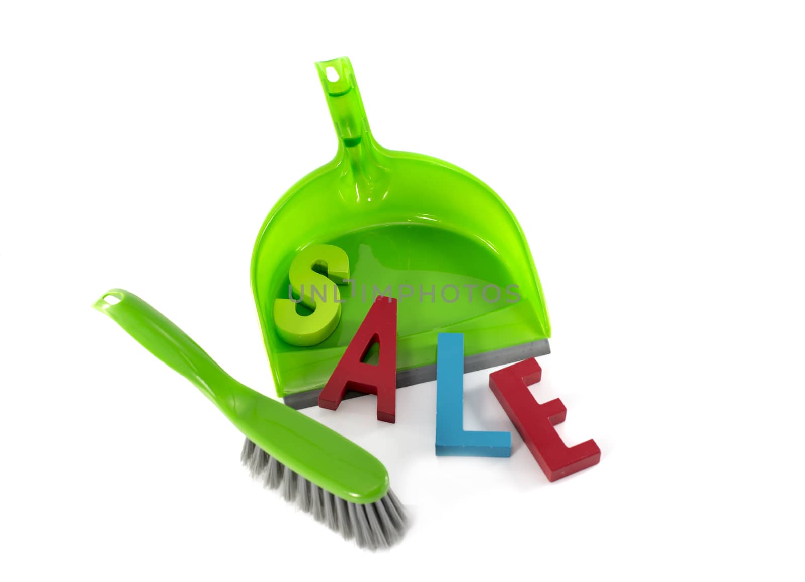 green dustpan with sale text letters in red and blue