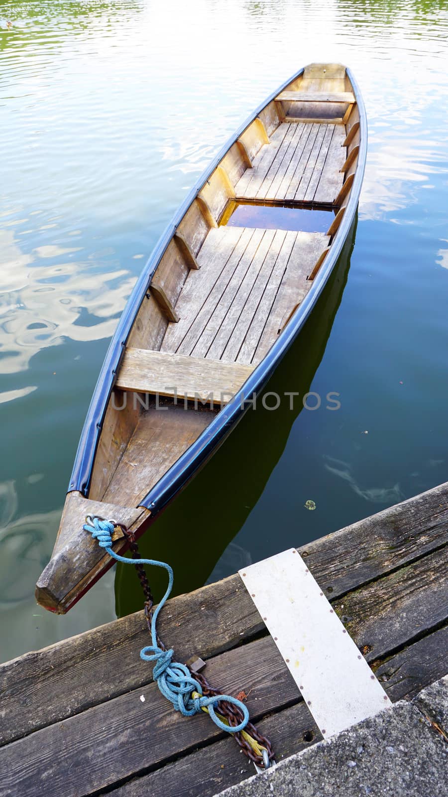 Wood boat in the lake and pier