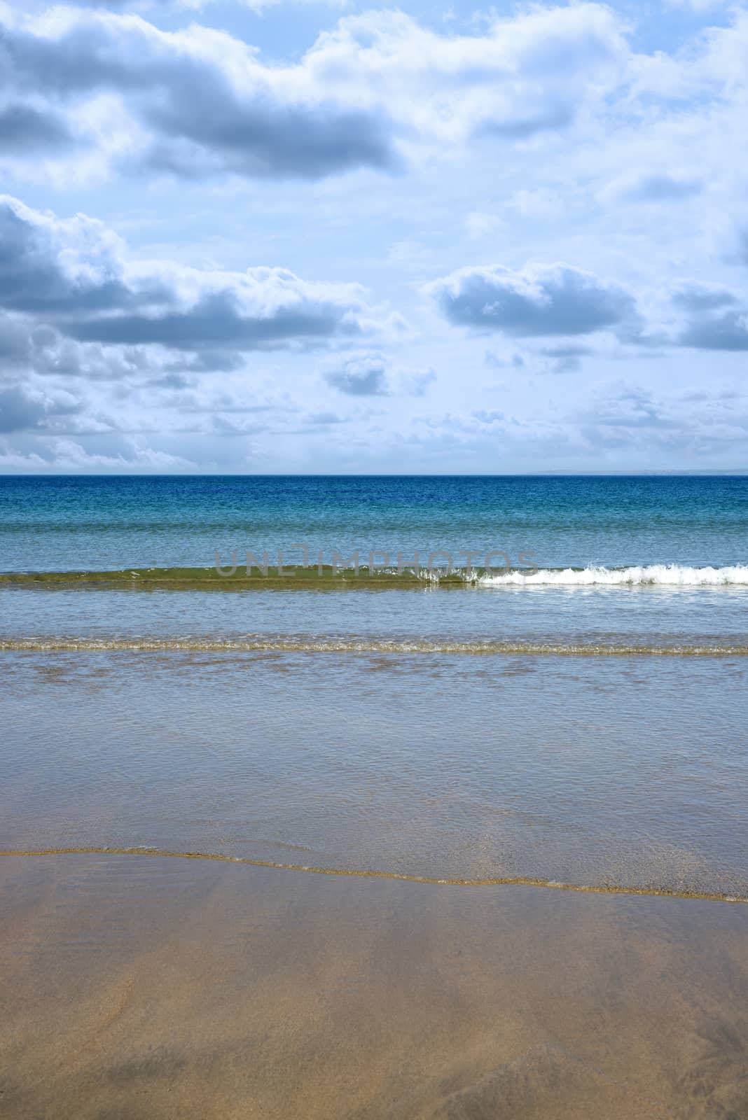 gentle blue waves lashing onto ballybunion beach by morrbyte