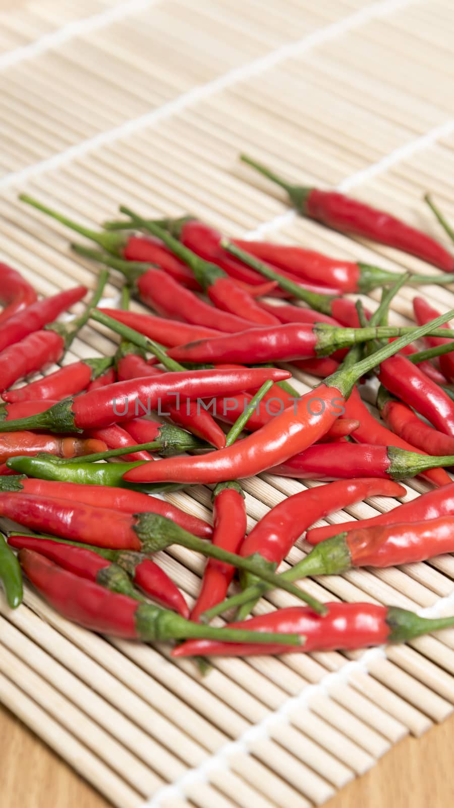 red chili peppers on wood table background