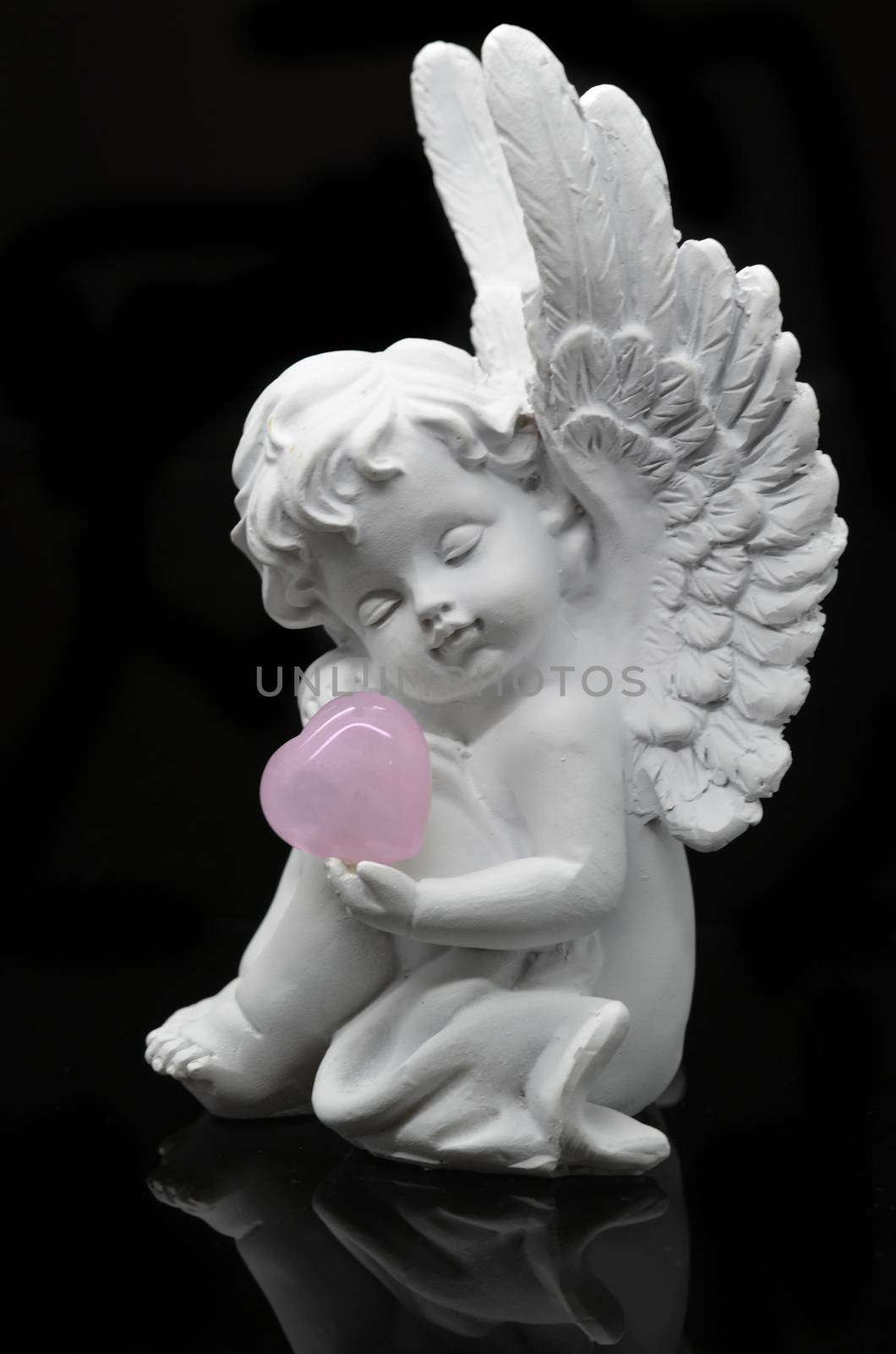 White Angel holding Rose Quartz heart by stellar
