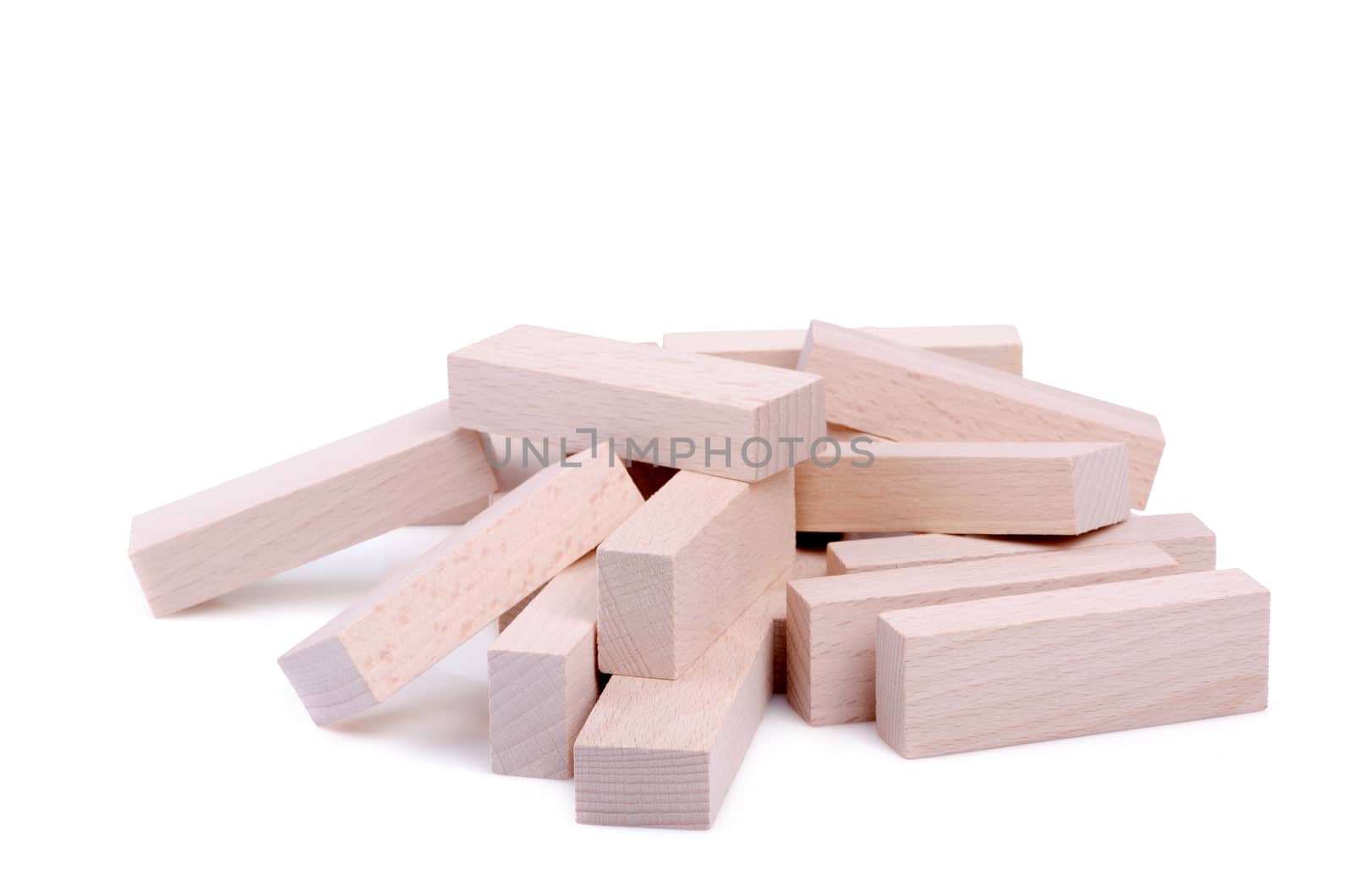 Pile of wooden bricks isolated on white background.