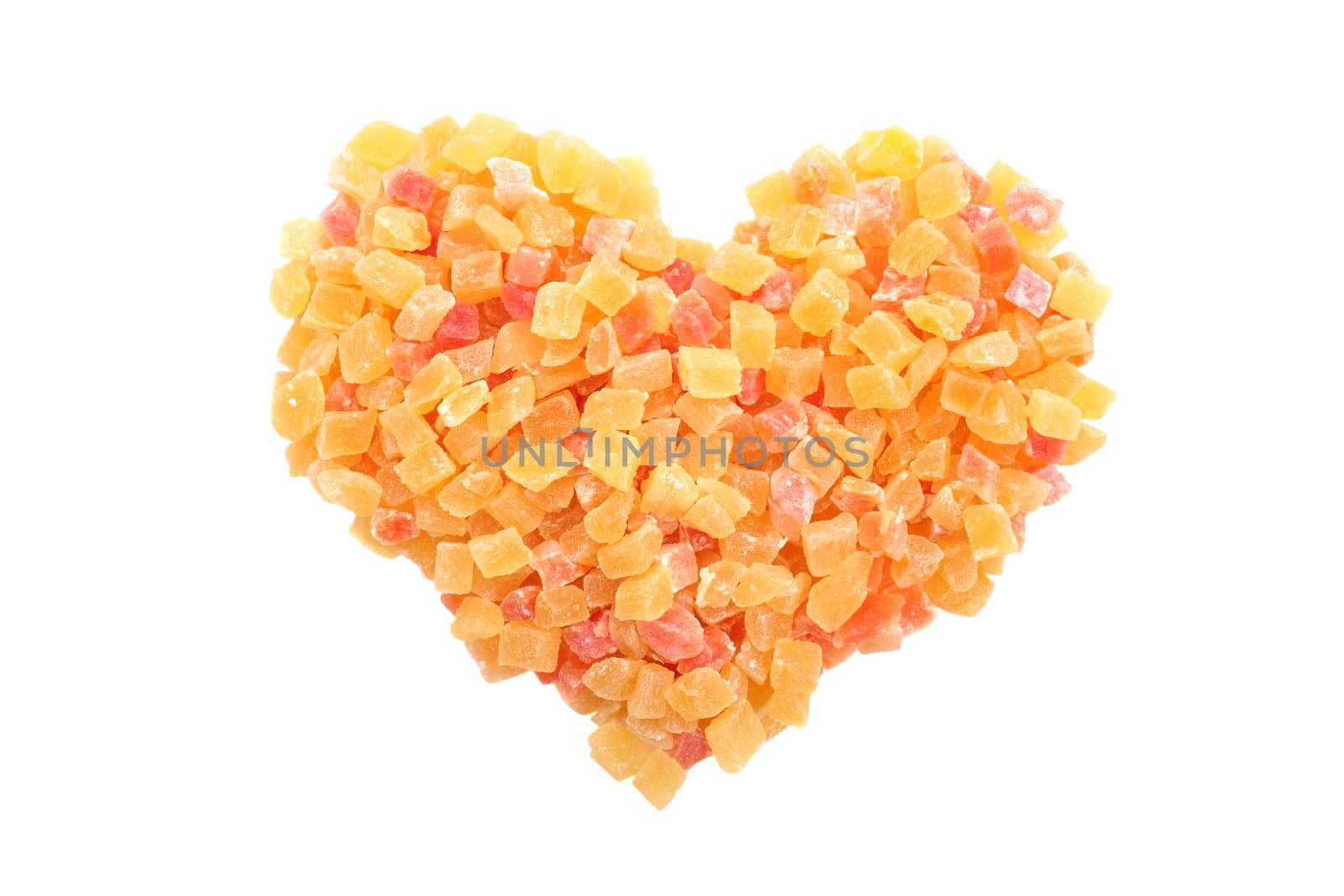Dried pineapple and papaya in a heart shape, isolated on a white background