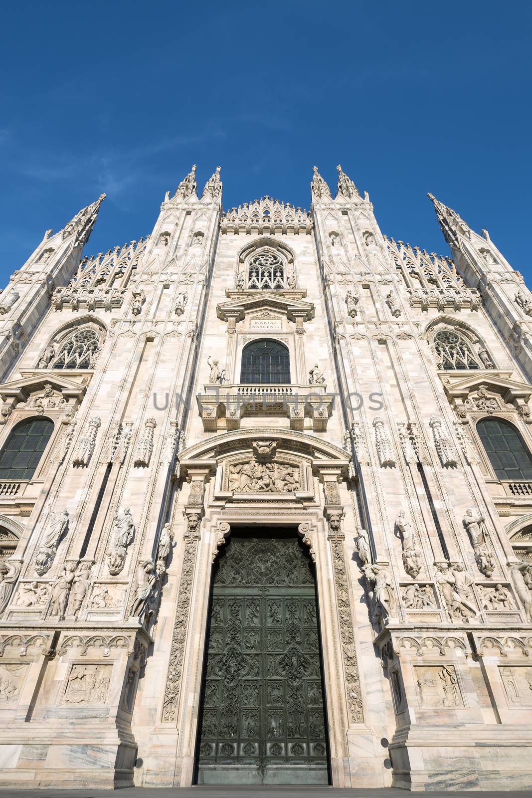 Milan Cathedral door (Duomo di Milano), Italy. Dedicated to Santa Maria Nascente