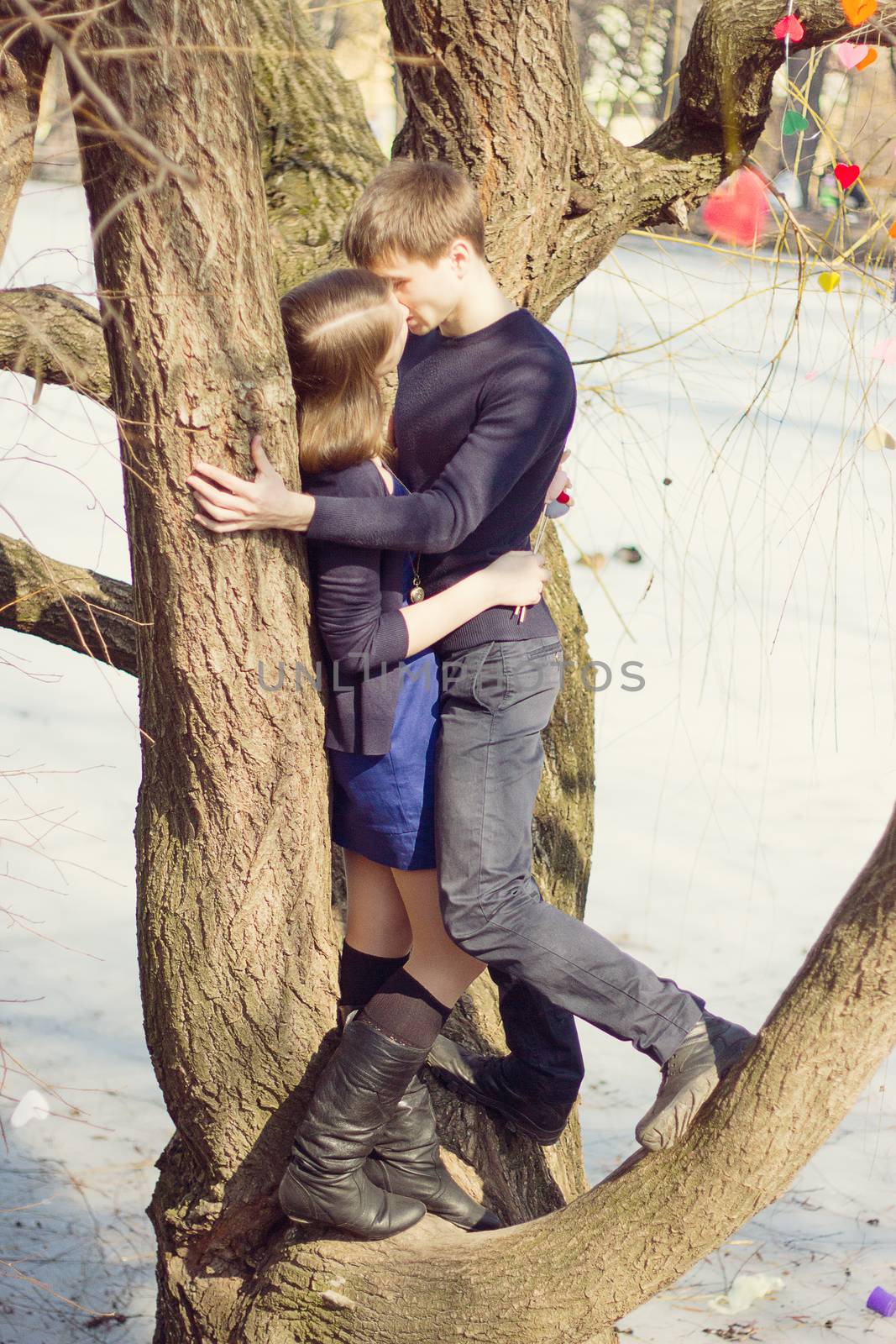 Romantic Teenage Couple By Tree In Autumn Park