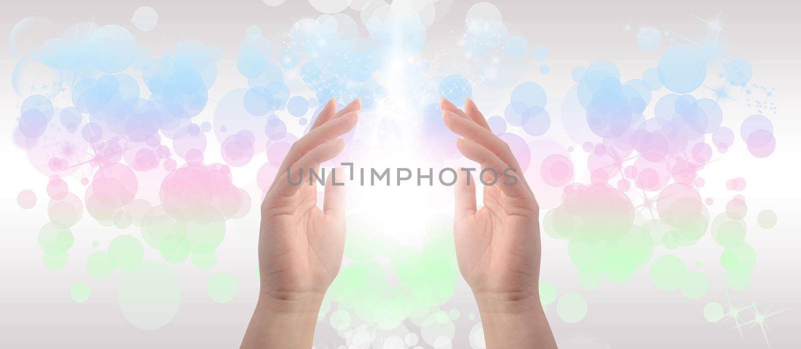 Healing Hands on a sparkling pastel coloured background