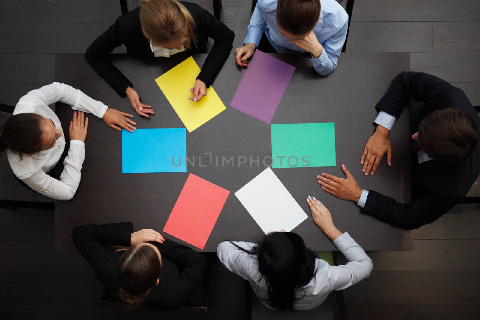 business people with colored paper by ALotOfPeople