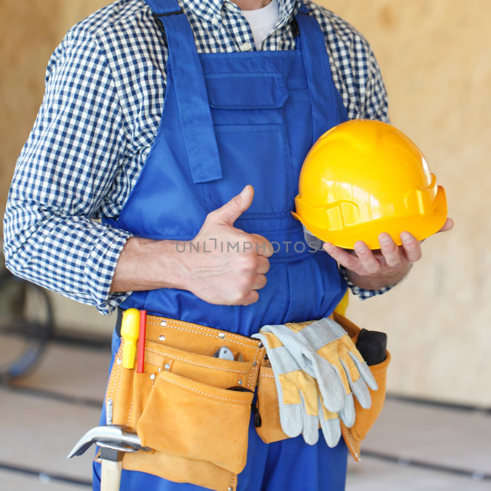 close-up of workman gives thumbs up