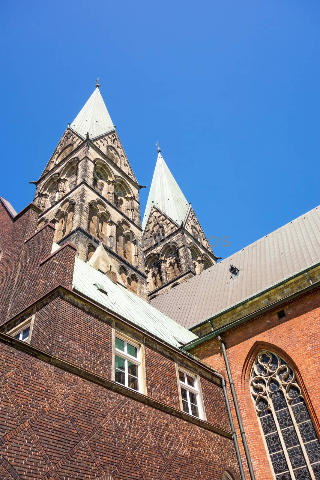 Bremen, Germany - June 7, 2014: Twin towers of Sankt Petri Cathedral - view from patio, garden