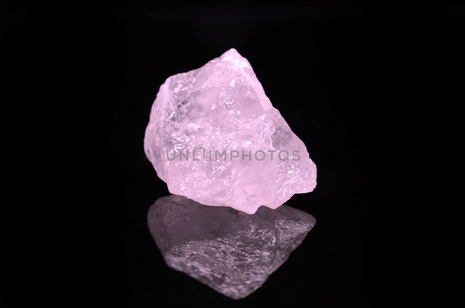 Sample of a beautiful Rose Quartz nature specimen isolated on black background