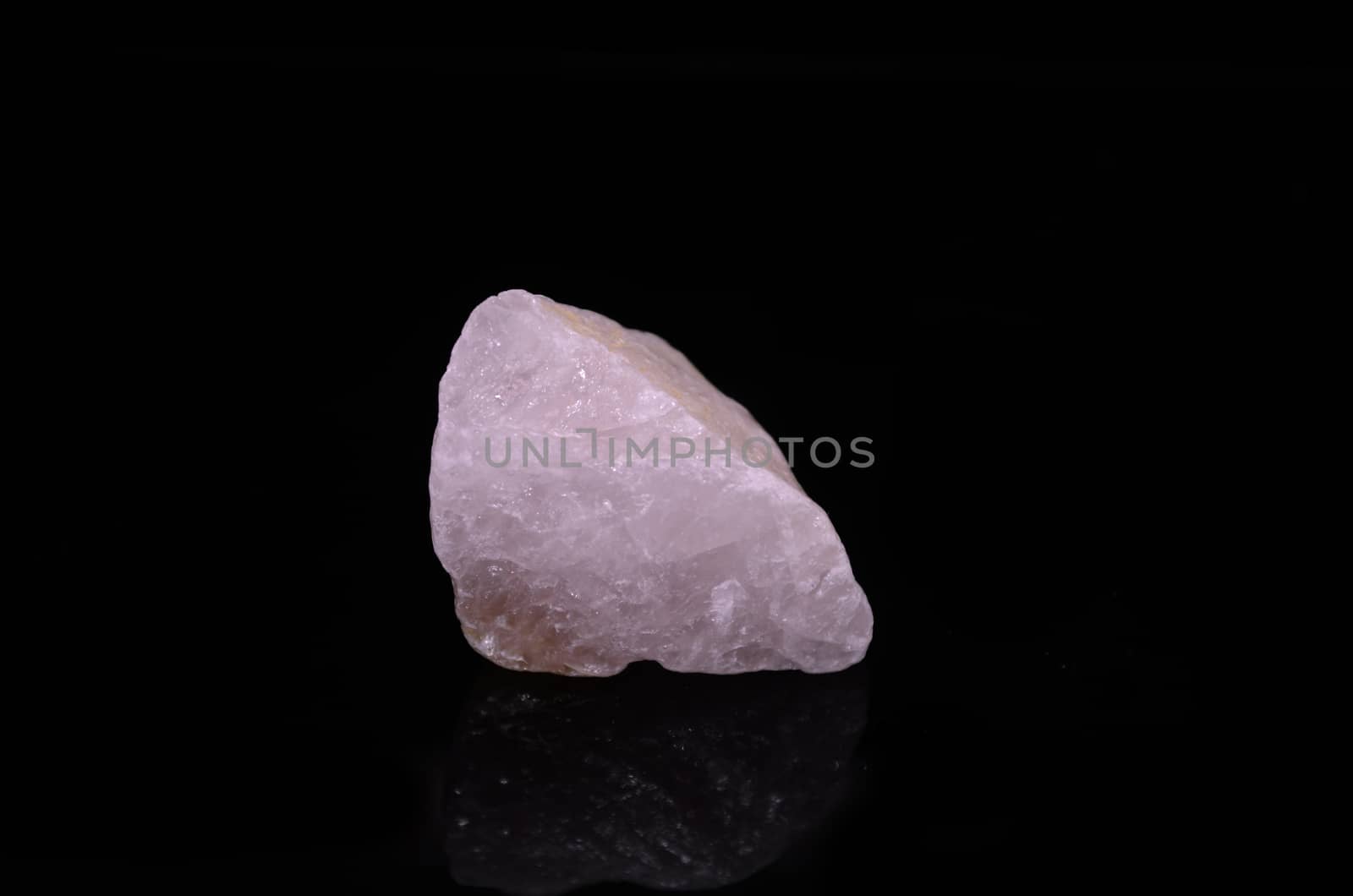 Sample of a beautiful Rose Quartz nature specimen isolated on black background