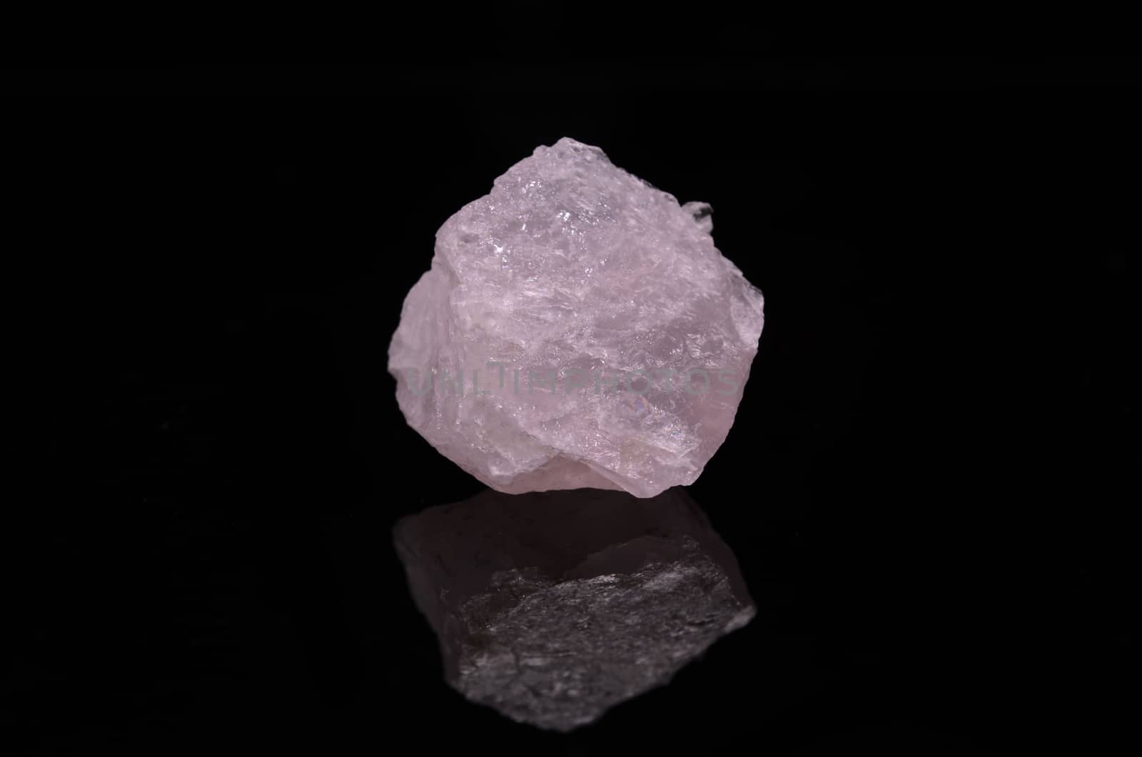 Sample of a beautiful Rose Quartz nature specimen isolated on black background