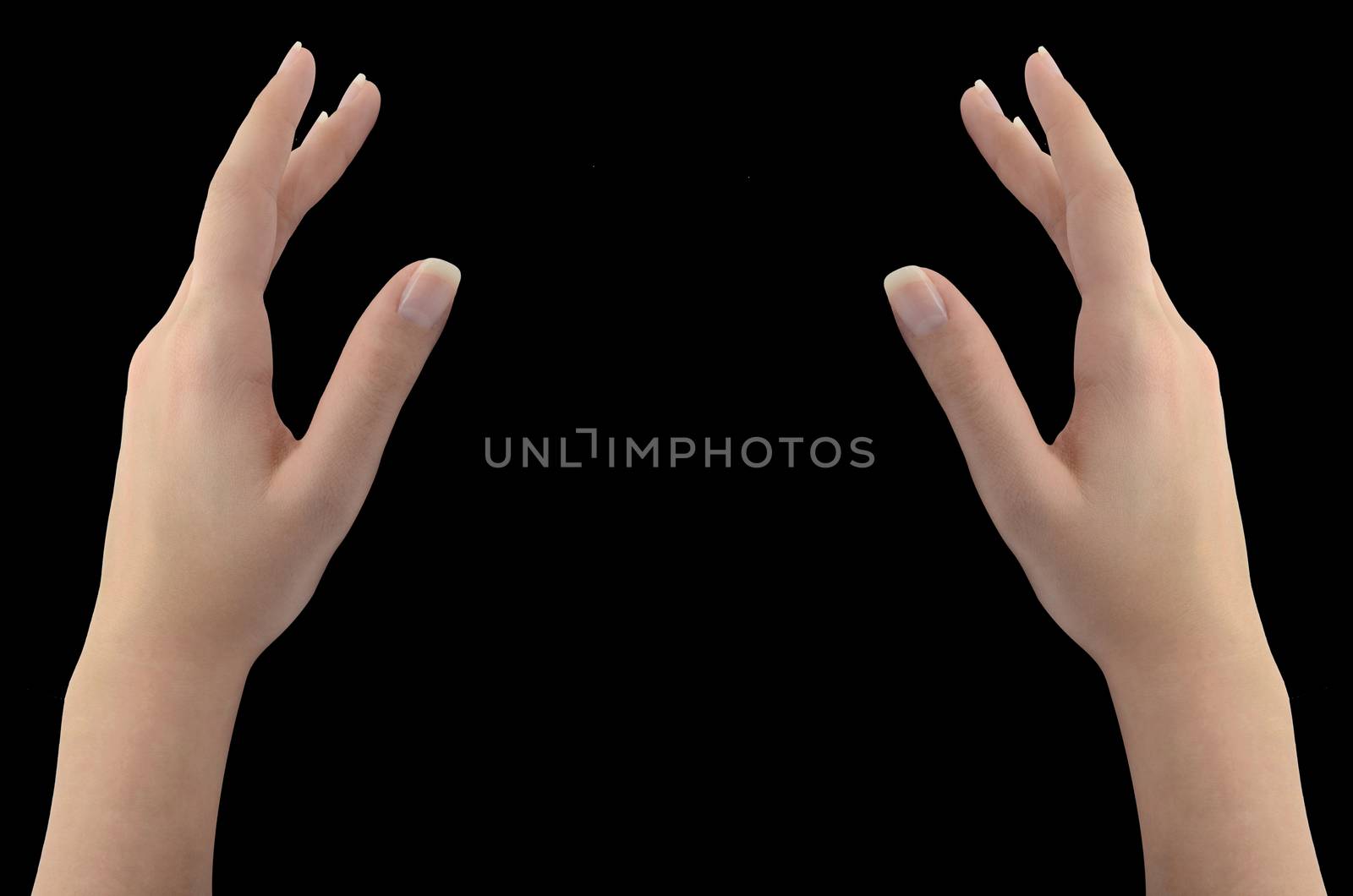 Woman's healing hands isolated on black background