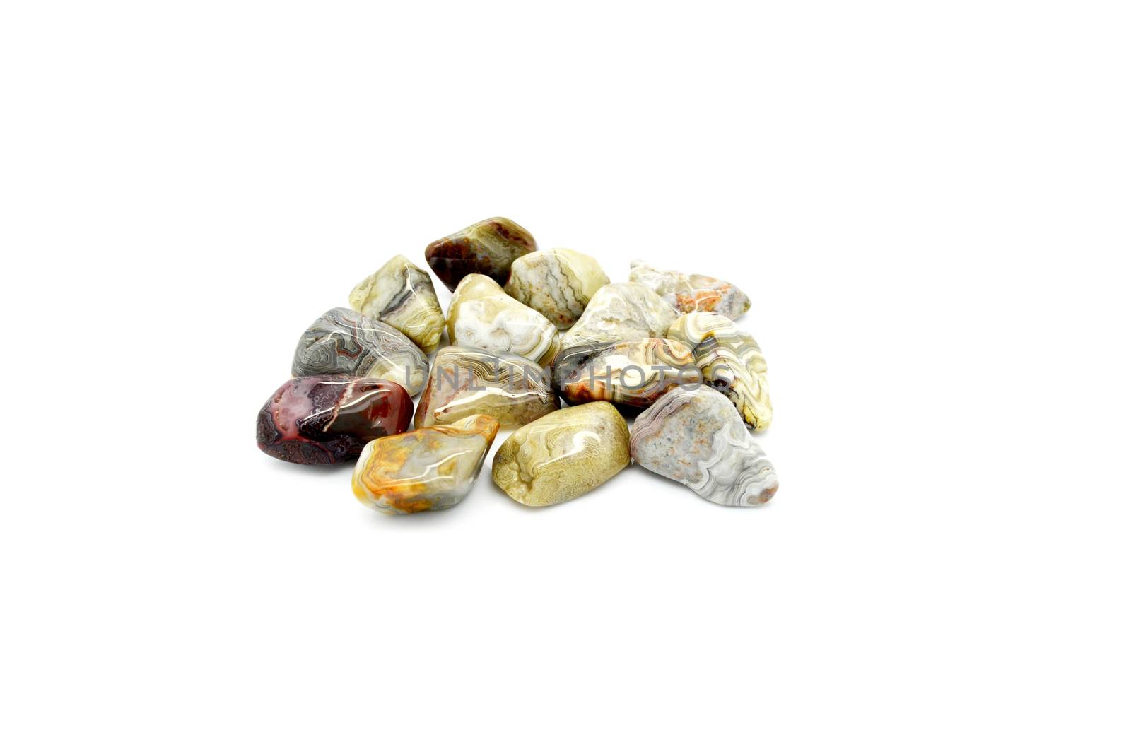 Set of a beautiful tumbled crazy lace agate semiprecious stones isolated on white