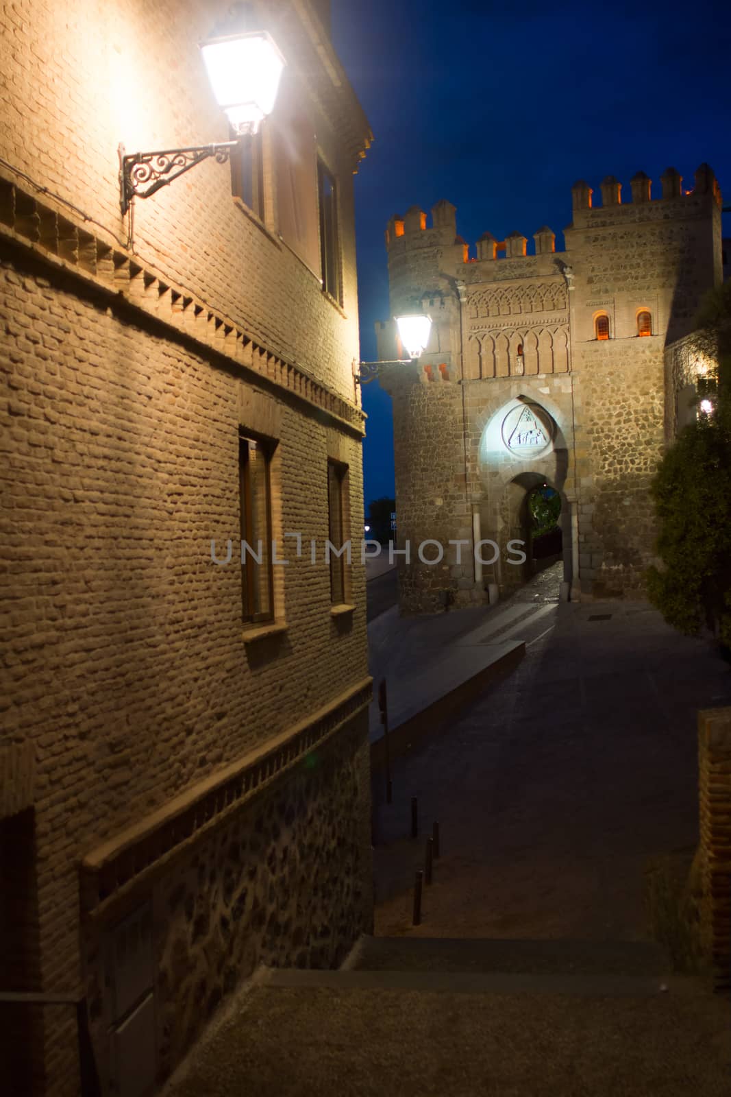 Night view of the gate in Toledo by BIG_TAU