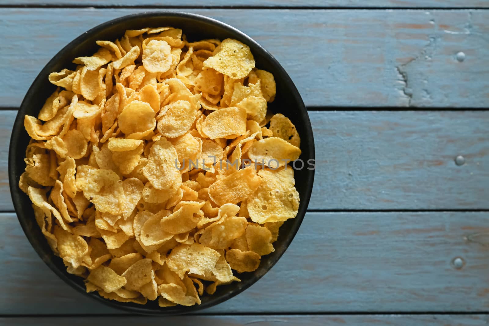 cornflakes on wooden table background