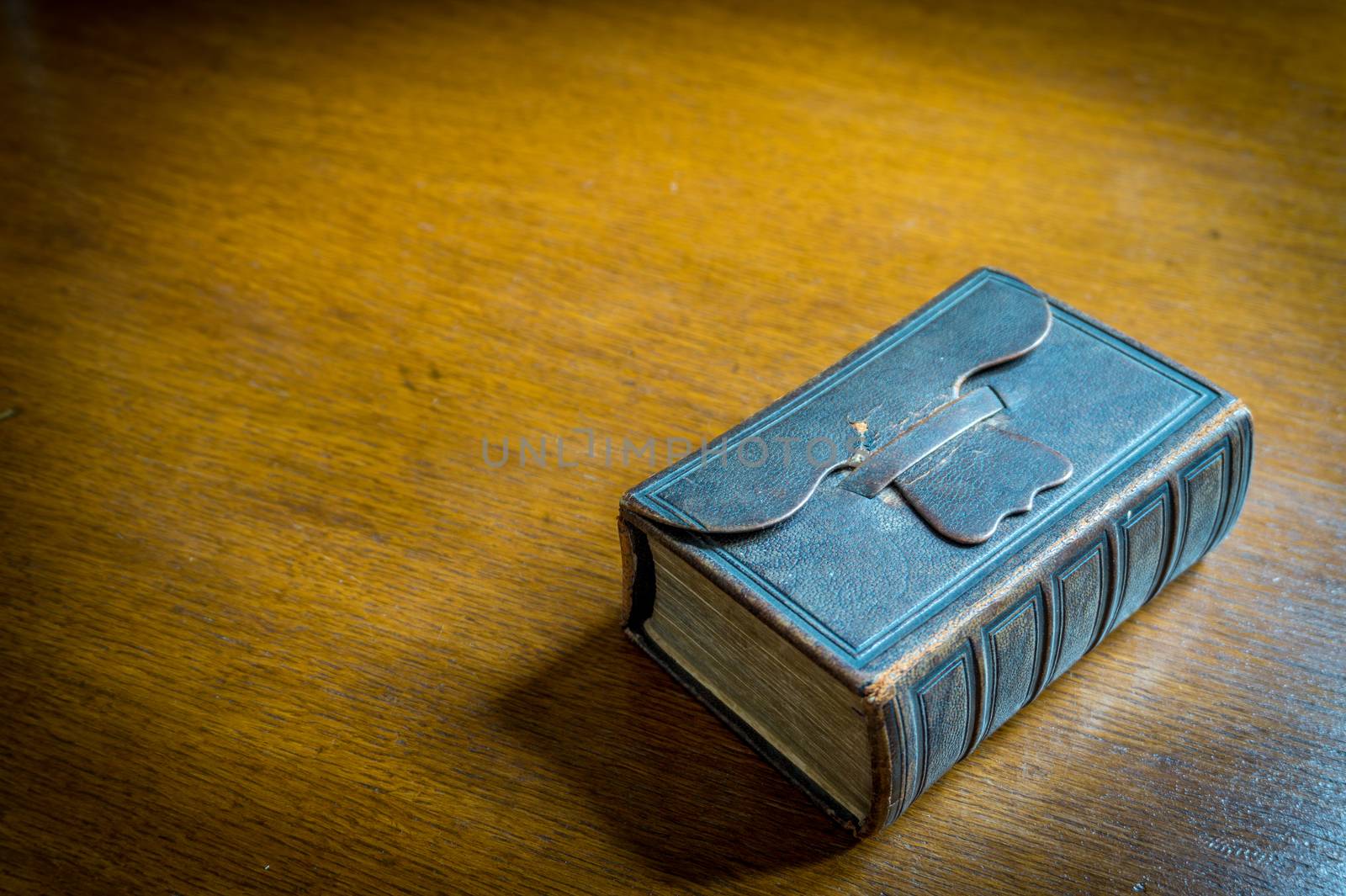 Closed 18th century Bible-Songbook on an old wooden table







Closed Bible-Songbook on a wooden table