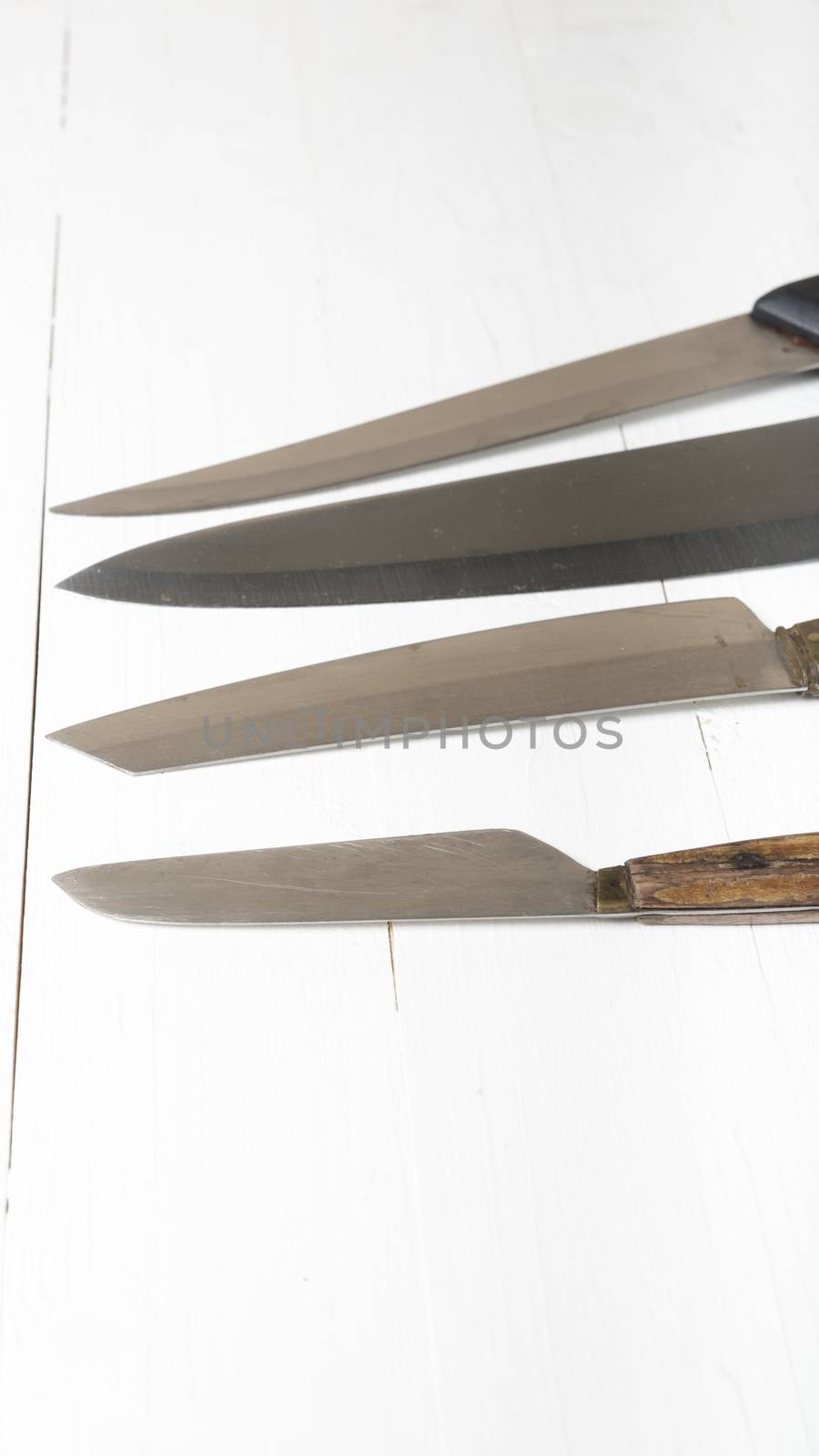 kitchen knife over white table background