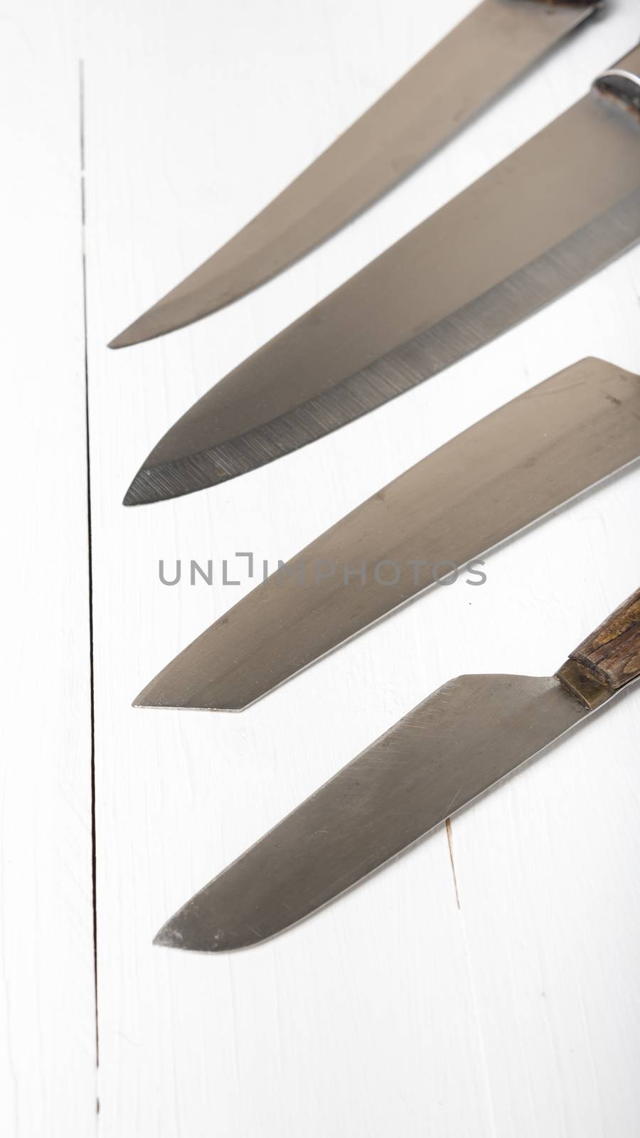 kitchen knife over white table background