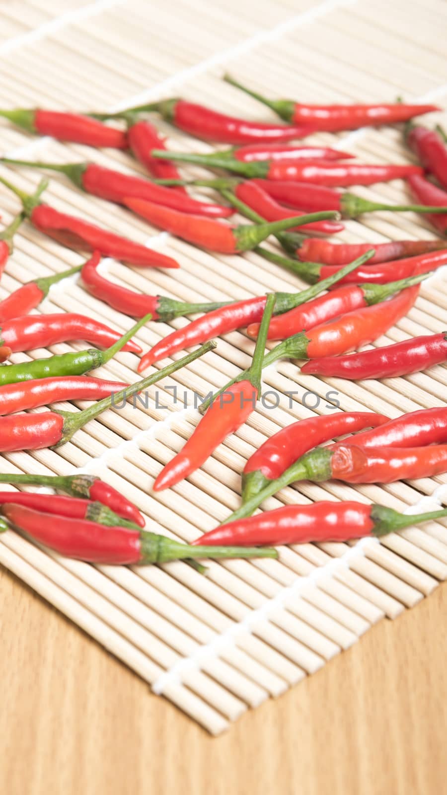 red chili peppers on wood table background