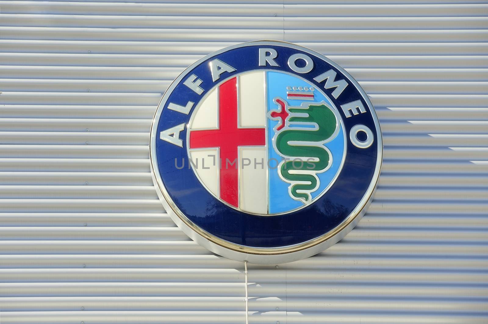 STOCKHOLM - MAY 1 2013: Alfa Romeo logo sign on showroom premises photographed on may 1th 2013 in Stockholm, Sweden.