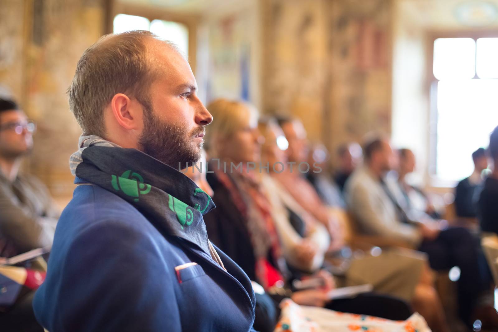 Presentation at Business Conference. Entrepreneurs in the audience at the conference hall.