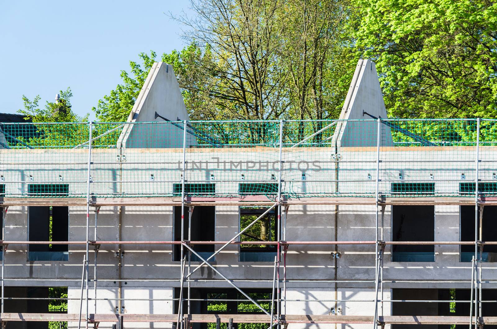 Prefabricated house construction of terraced houses. Here, from pre-made stone plate.