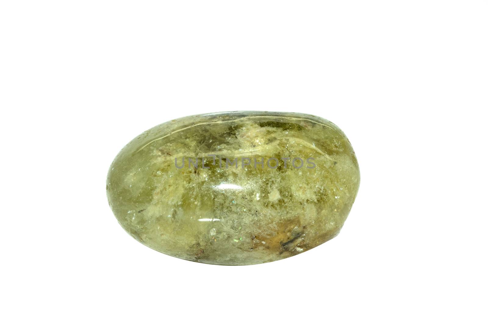 Sample of a beautiful tumbled Demantoid - Green Garnet semiprecious stone isolated on white