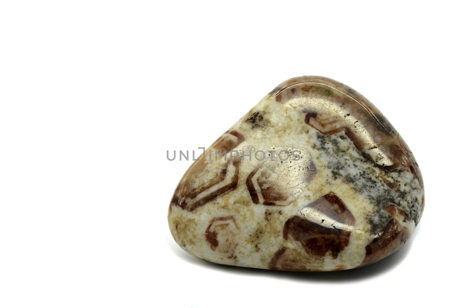 Sample of a beautiful tumbled Limestone Garnet semiprecious stones isolated on white