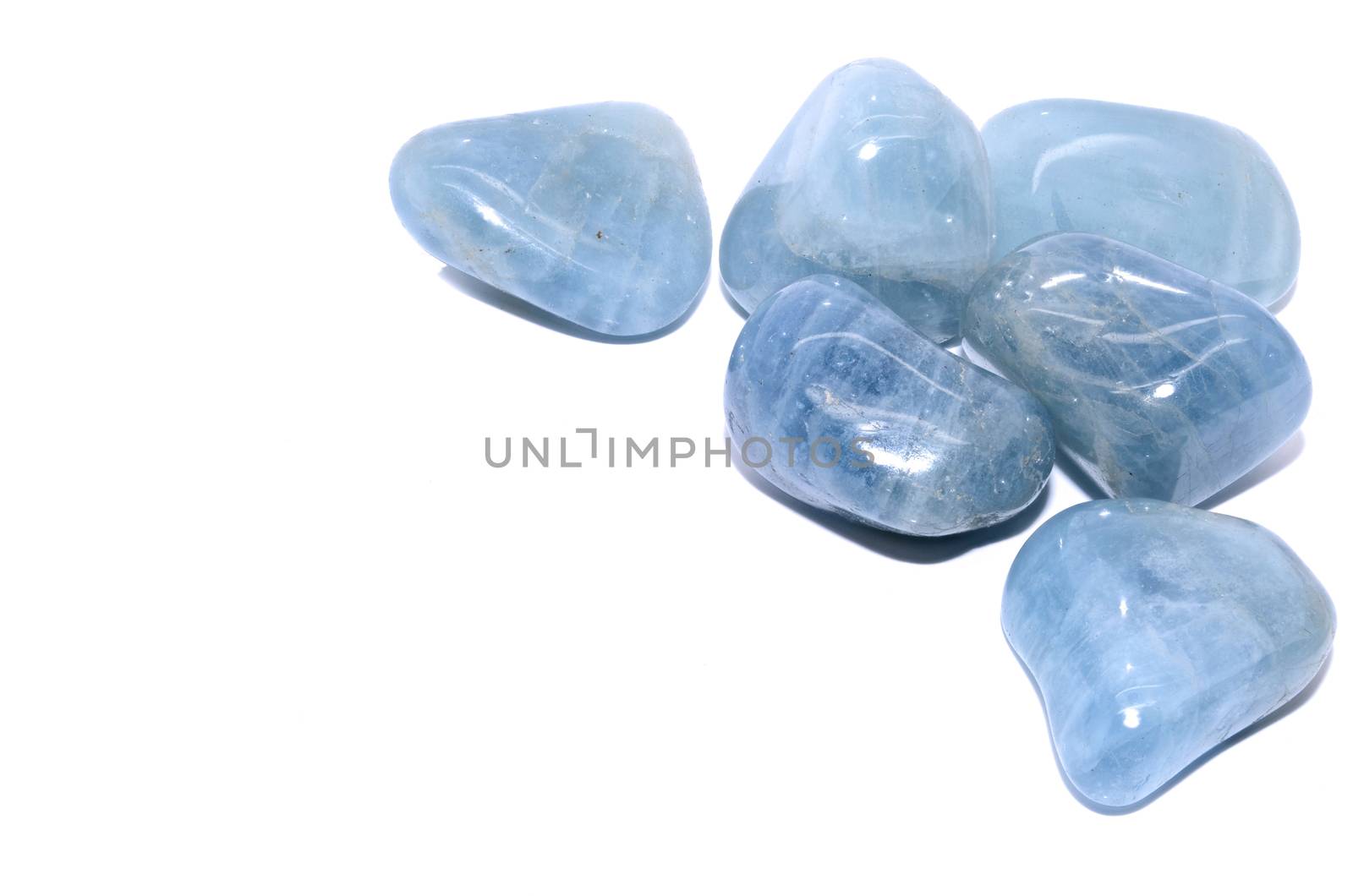 Set of a beautiful tumbled Aquamarine semiprecious stones isolated on white