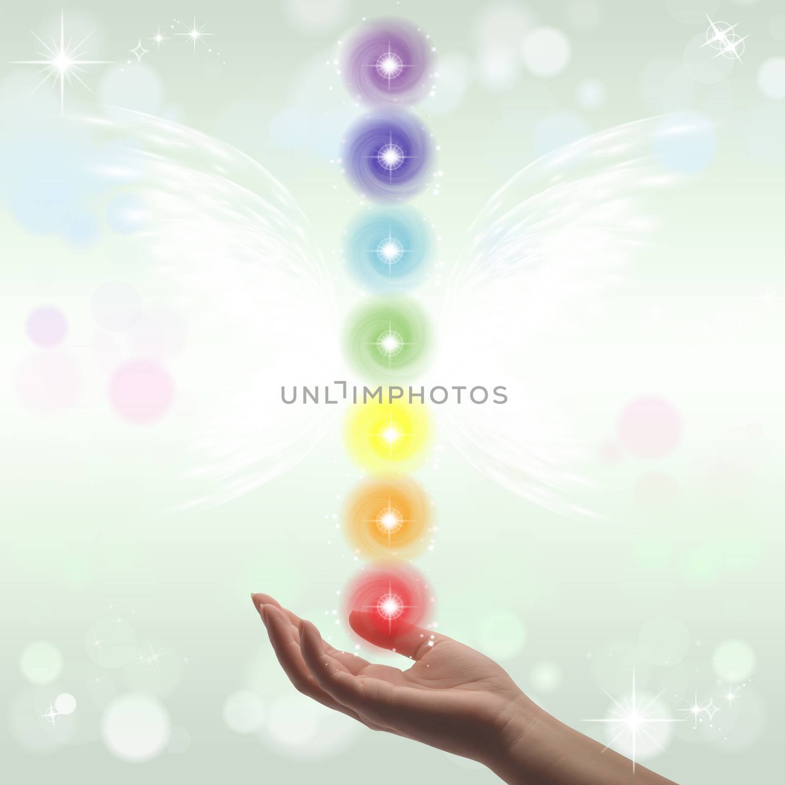 Healing Hand and seven chakras on a sparkling pastel coloured background
