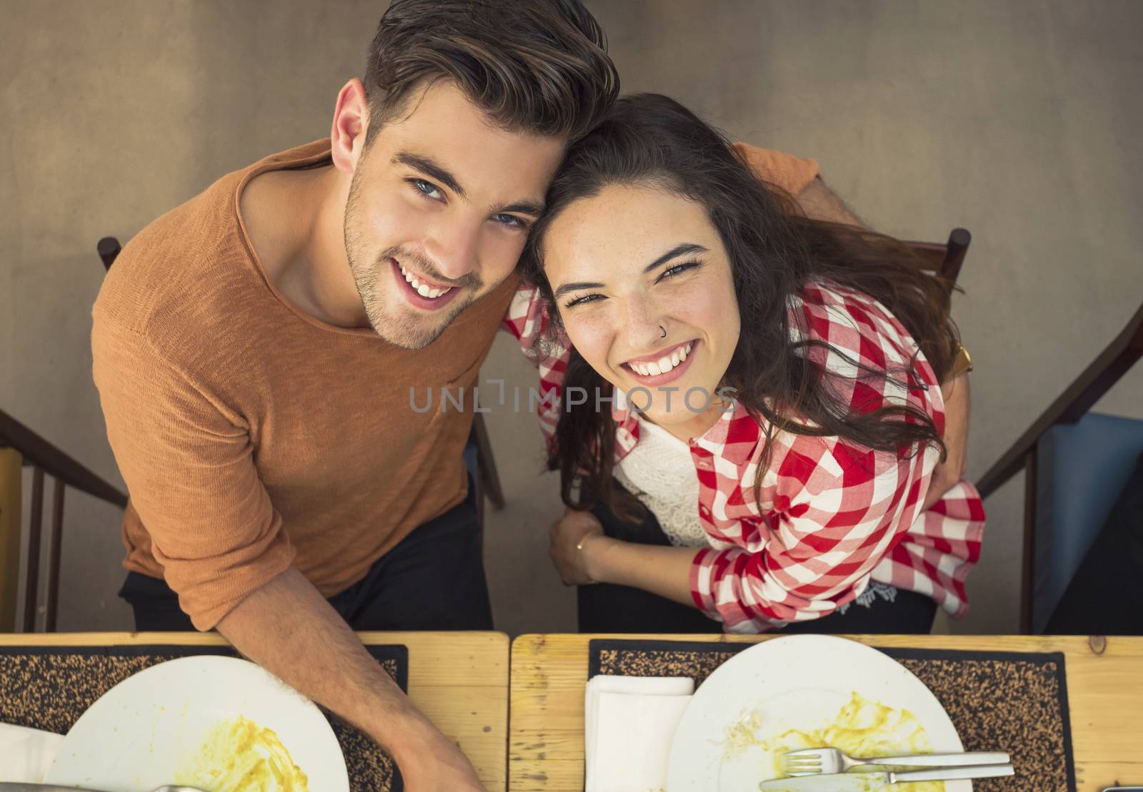 Top view of a young couple at the restaurant having a good time 