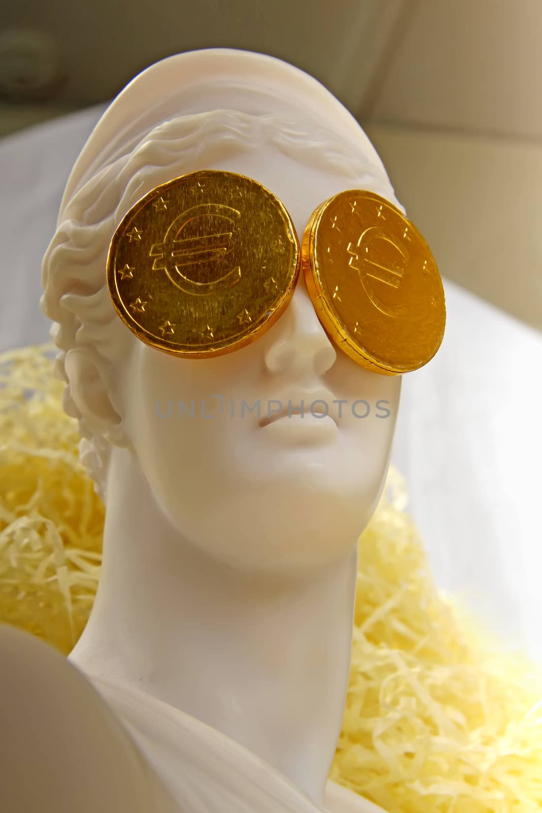 Greek crisis. The Greek goddess Aphrodite with euro coins on the eyes