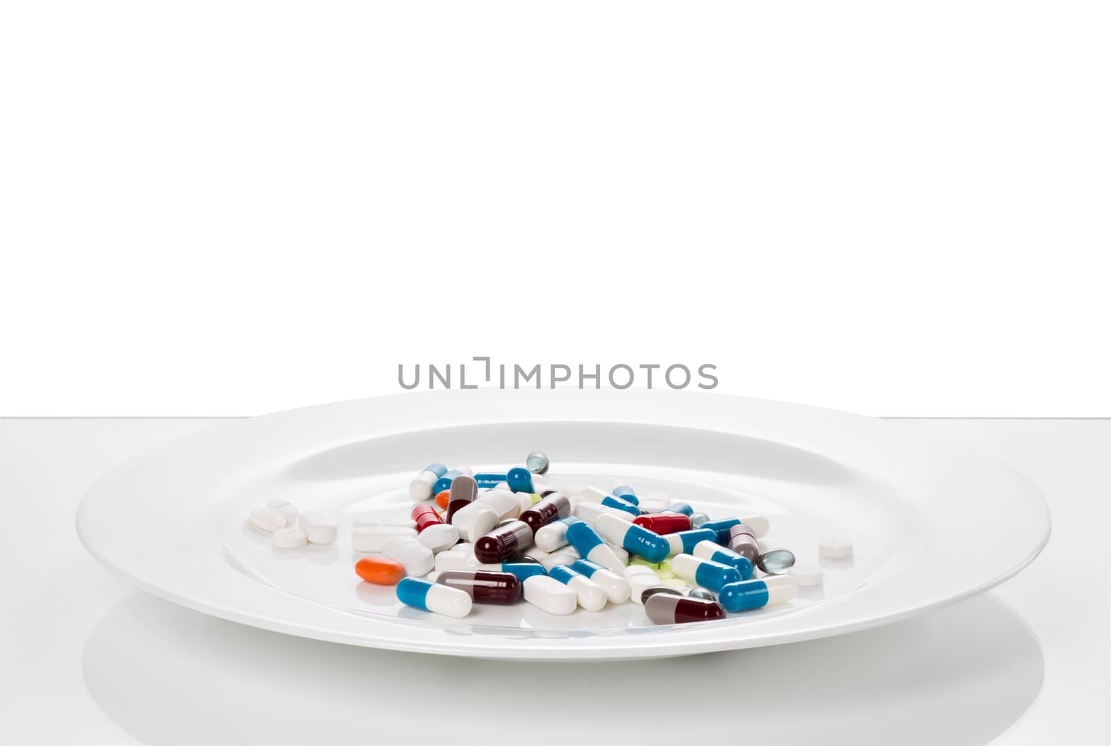 Tablets served on a white plate with knife and fork