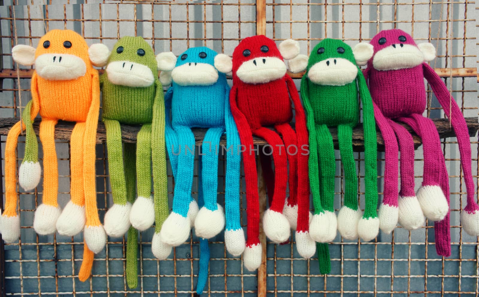 Amazing background of handmade product, group of homemade monkey with funny humorous in colorful, knitted monkeys make by knit from wool, woolen toy to happy new year 2016, so fun animal