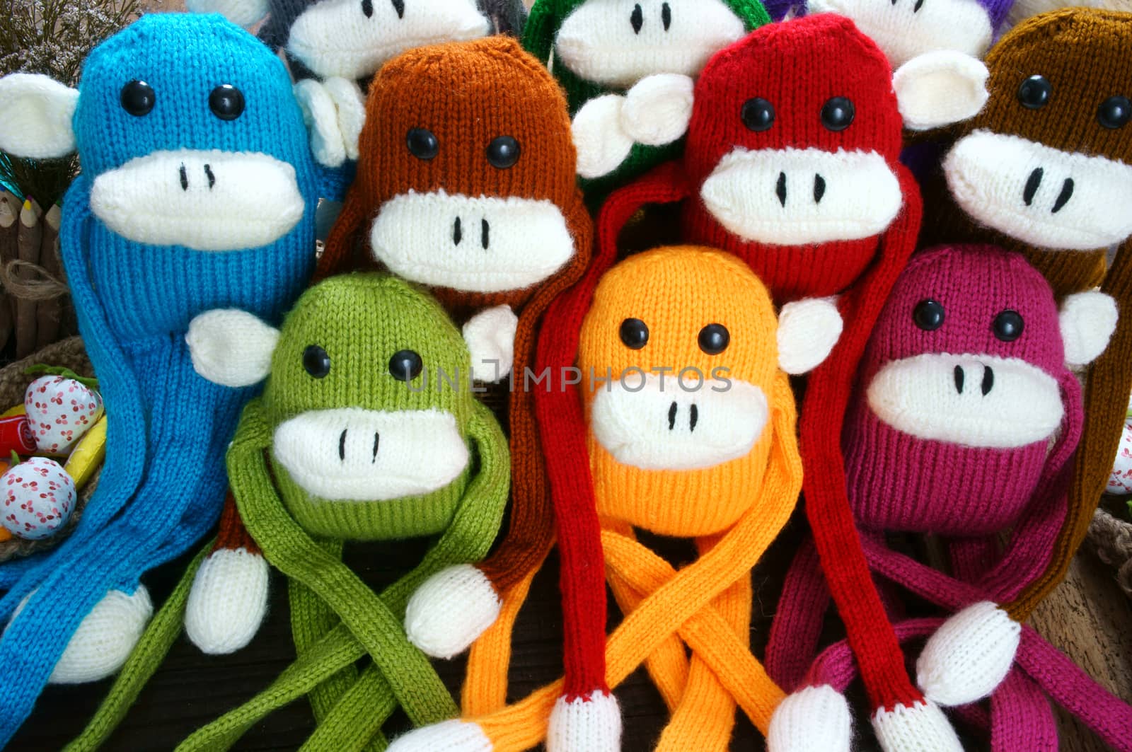 Amazing background of handmade product, group of homemade monkey with funny humorous in colorful, knitted monkeys make by knit from wool, woolen toy to happy new year 2016, so fun animal