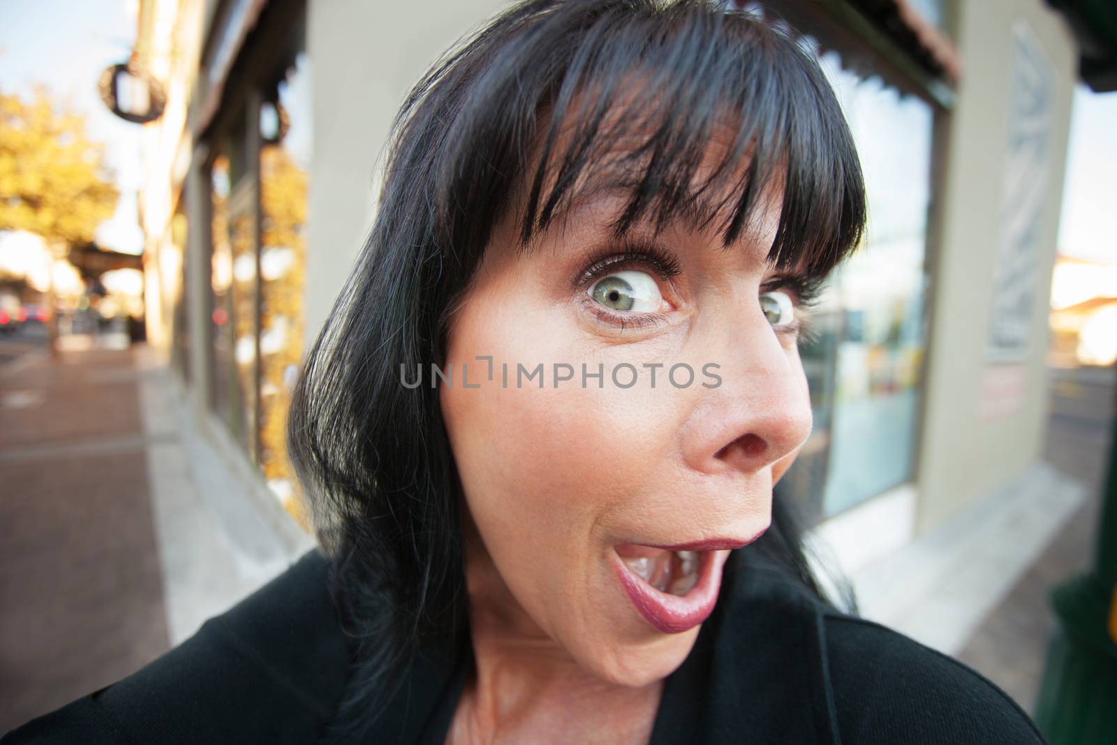 Woman takes an early morning selfie on downtown street