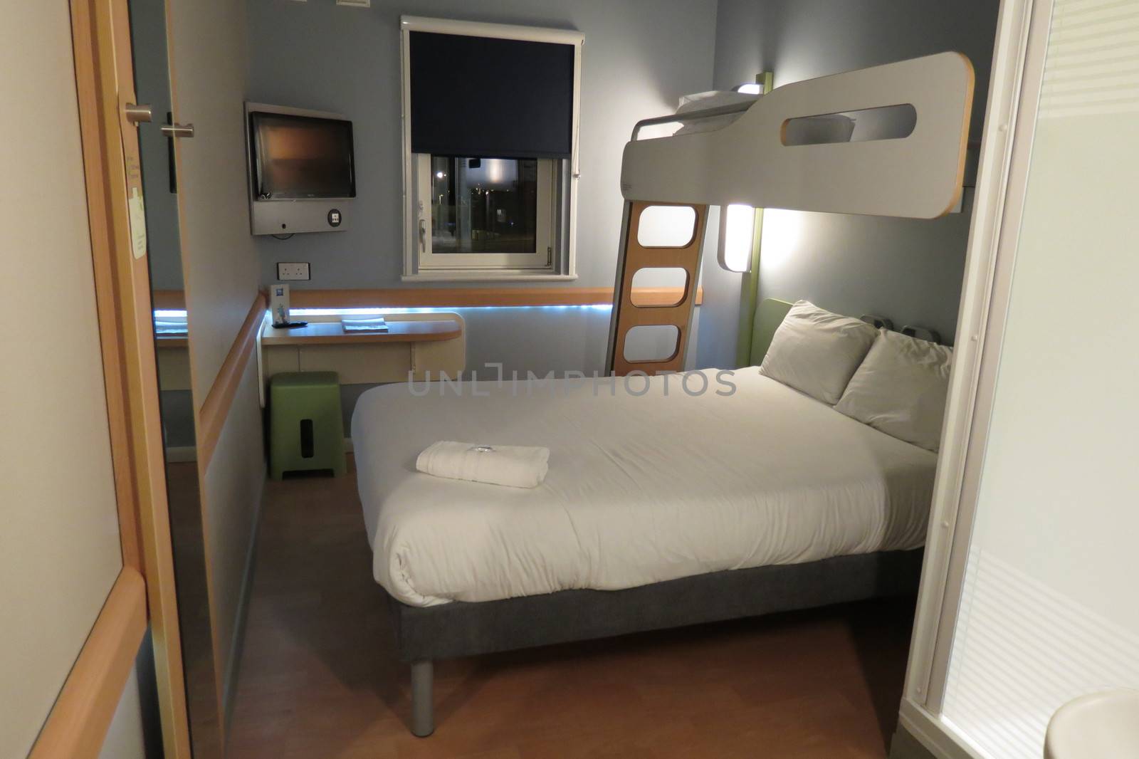 EDINBURGH, SCOTLAND, UK - CIRCA AUGUST 2015: Ibis budget hotel room with bed