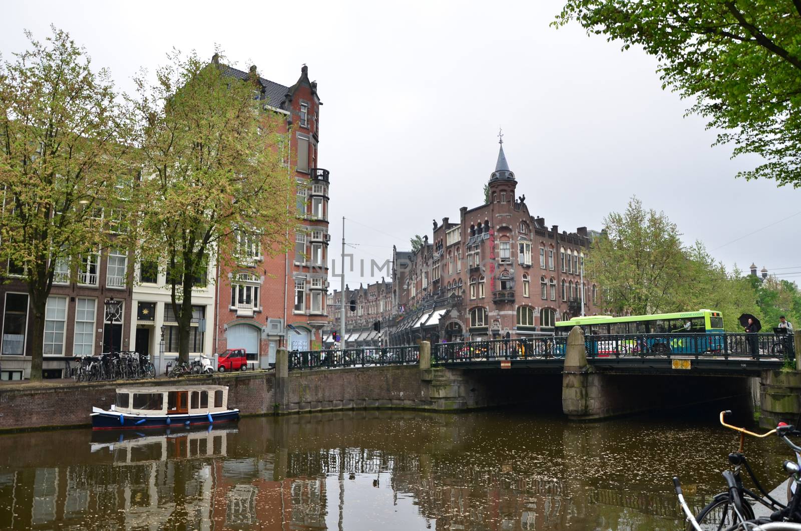 Amsterdam, Netherlands - May 16, 2015: People at Westermarkt District in Amsterdam on May 16, 2015. Amsterdam is the capital and most populous city of the Netherlands.