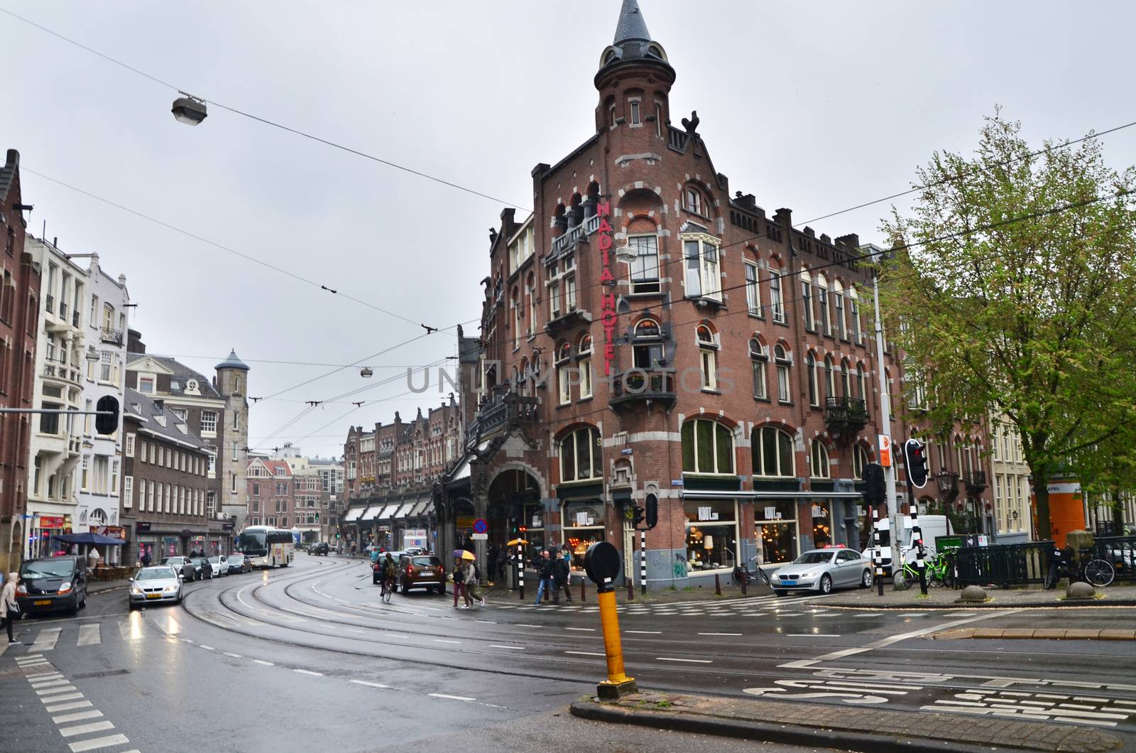 Amsterdam, Netherlands - May 16, 2015: People at Westermarkt District in Amsterdam on May 16, 2015. Amsterdam is the capital and most populous city of the Netherlands.