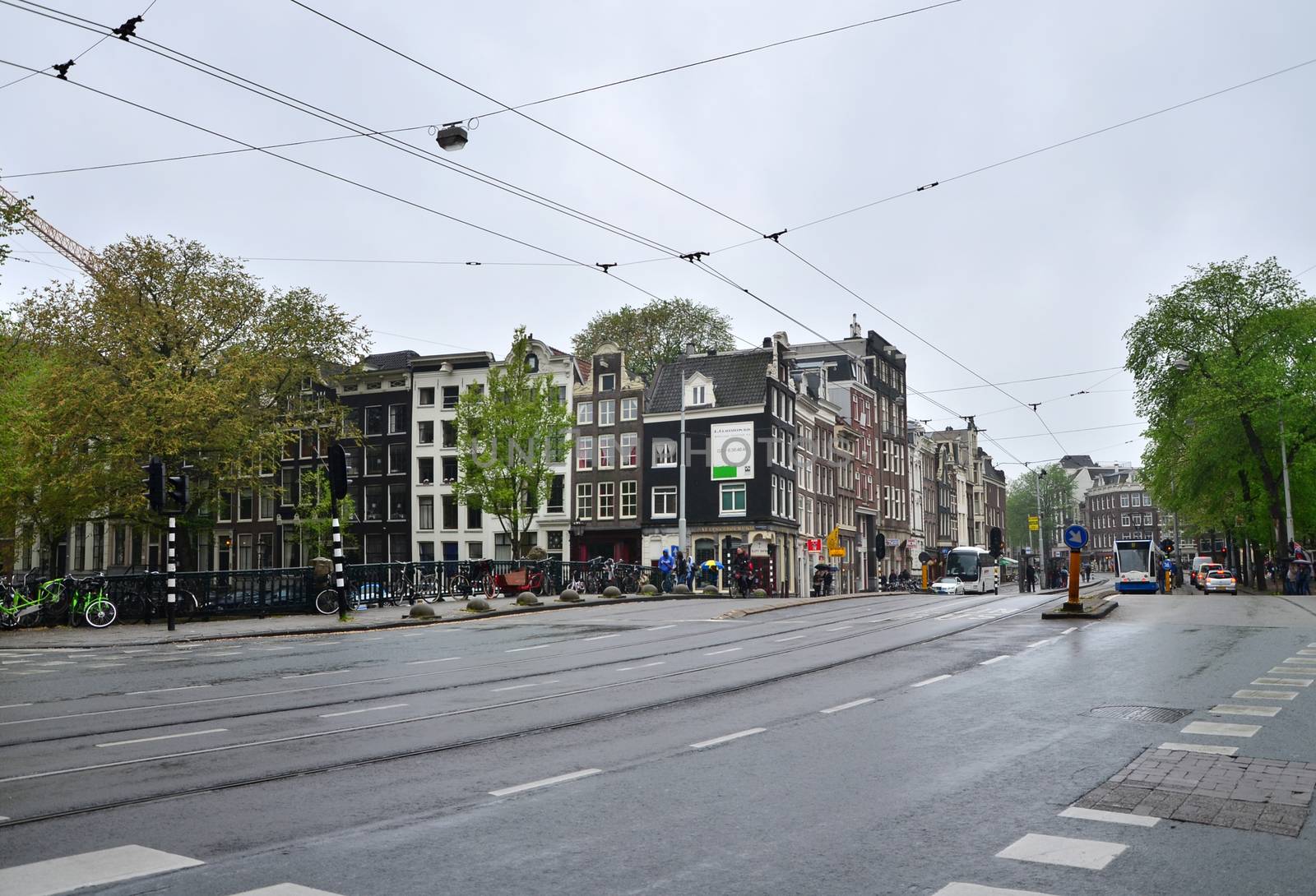 Amsterdam, Netherlands - May 16, 2015: People at Westermarkt District in Amsterdam by siraanamwong