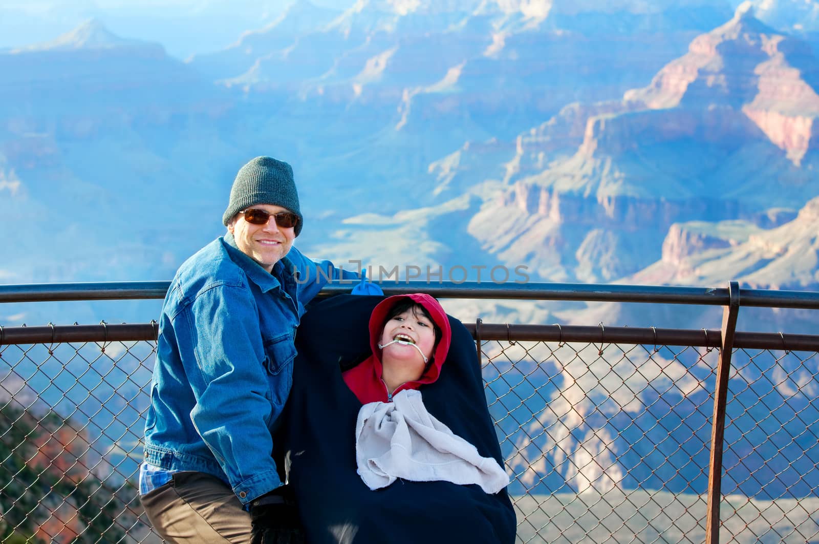 Father with disabled son in wheelchair at Grand Canyon, Arizona by jarenwicklund