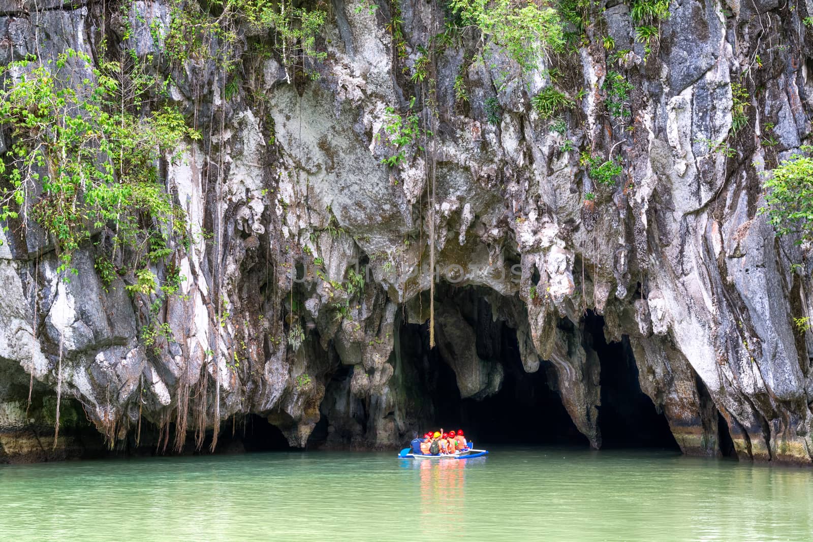 Puerto Princesa, Philippines  - May 24, 2014:Visitors enter the Subterranean River in Puerto Princessa. Puerto Princesa Underground River as one of the New 7 Wonders of Nature. El Nido, Philippines  - May 22, 2014: Island hopping with traditional banca boat in El Nido , Palawan - Philippines . Island hopping is popular activity of tourists visiting Palawan.PUERTO PRINCESA,  PHILIPPINES - MAY 24, 2014: Visitors enter the Subterranean River in Puerto Princessa on May 24.  