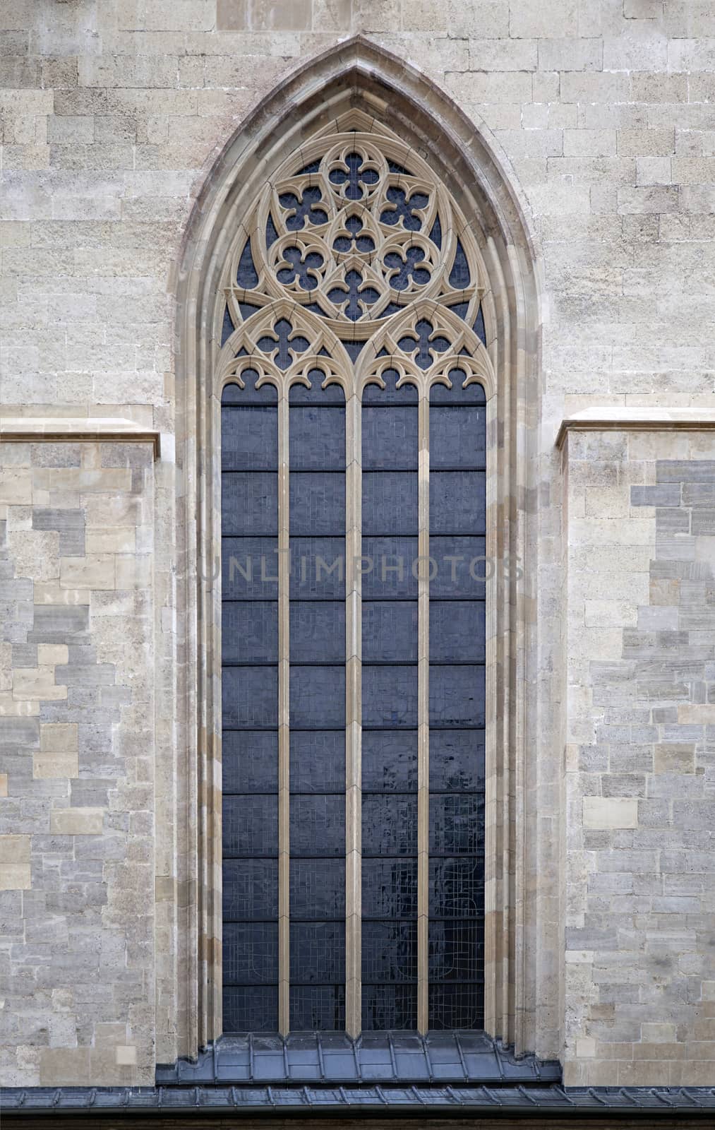 Ornamented window of a cathedral in gothic style