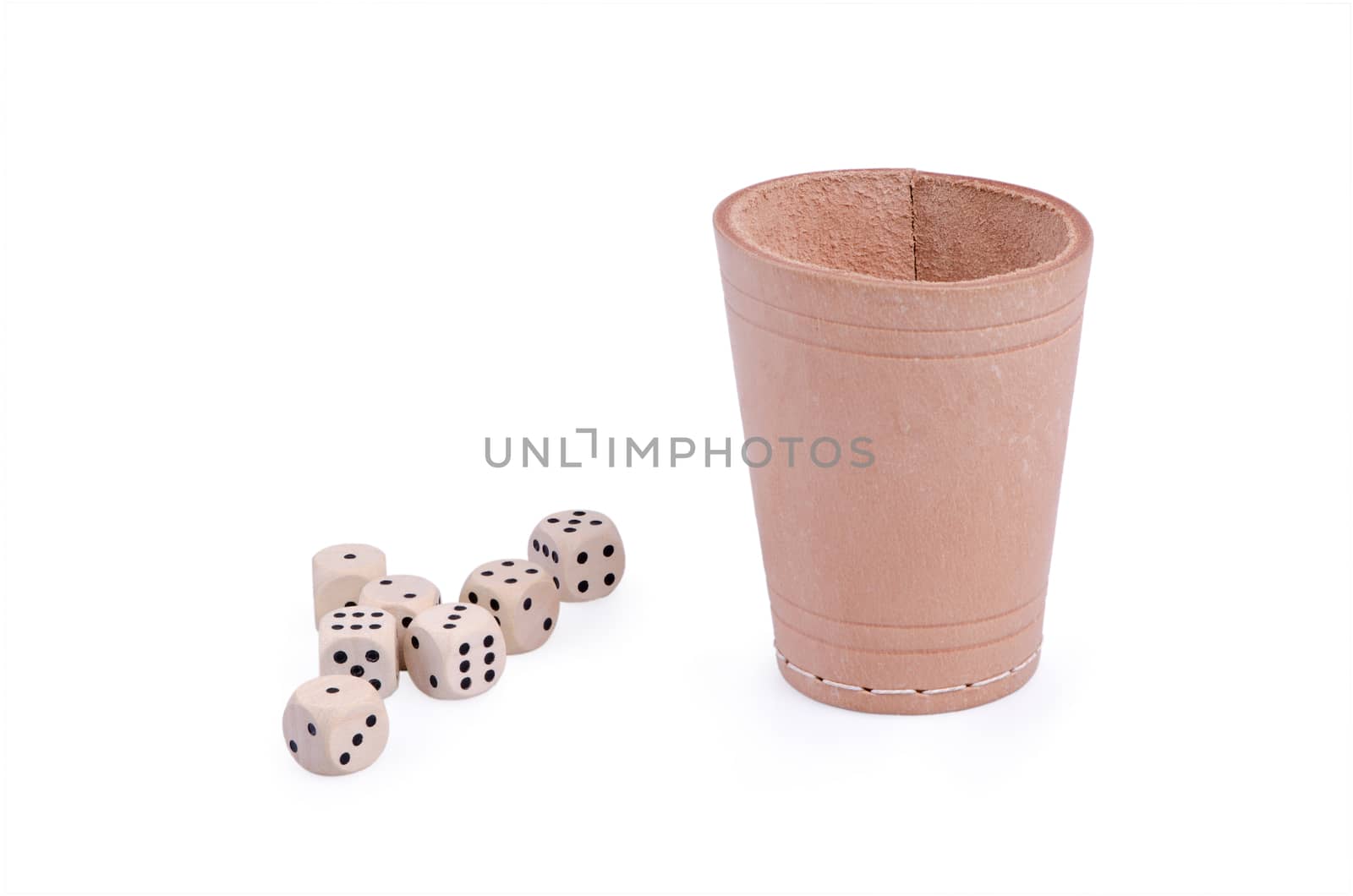 Seven wooden dice and leather pot isolated on white background.