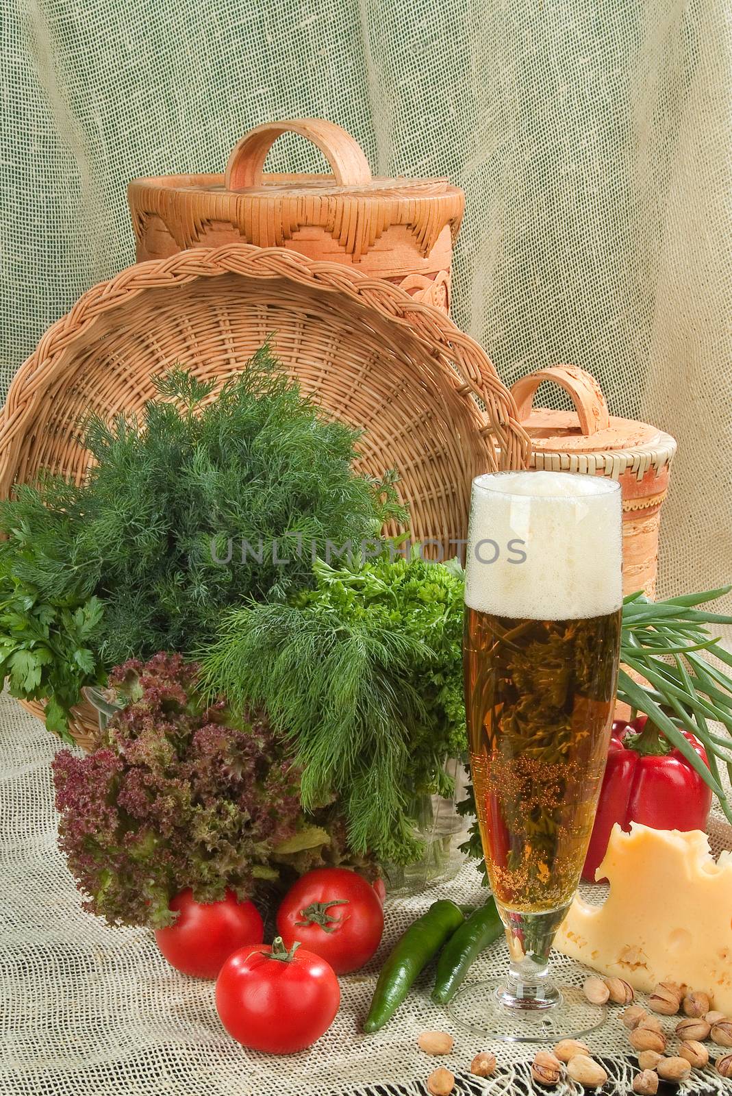 Still life with sausage, beer and vegetables