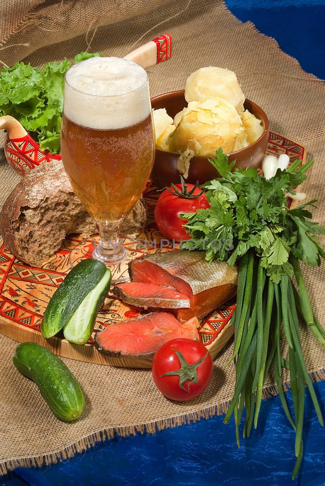 Still life with glass of beer and vegetables