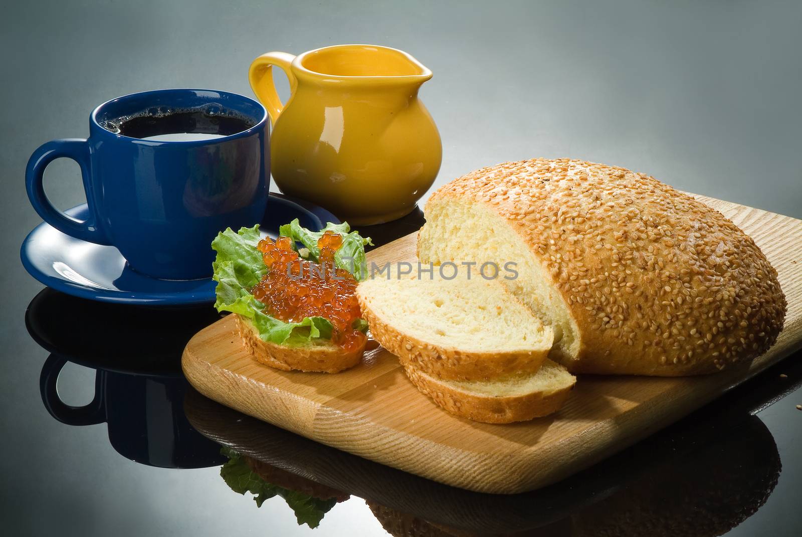 Still life with red caviar and cup of tea