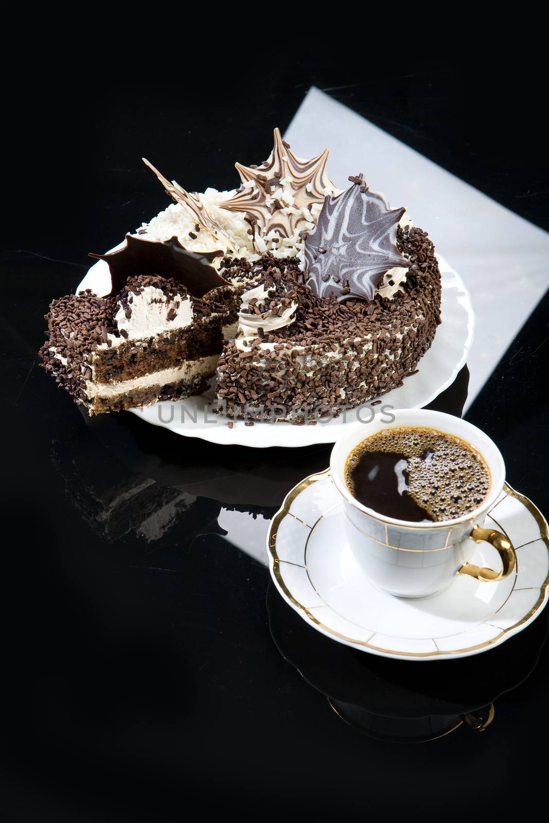 Coffee and chocolate cake on a glass background